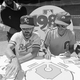 Umpire James Williams, a Strat-o-Matic employee, keeps an eye on the action as Jim Schaefer, left, and Jon Halpern battle it out in the only baseball game in town.